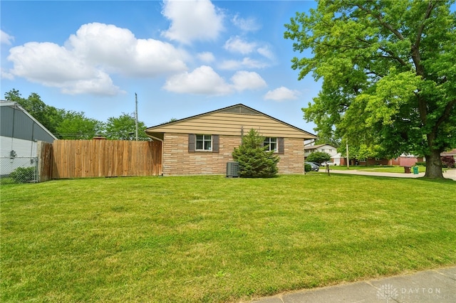 75 Royal Dr, Springboro, OH 45066 - view of side of home featuring a cooling unit and stone siding