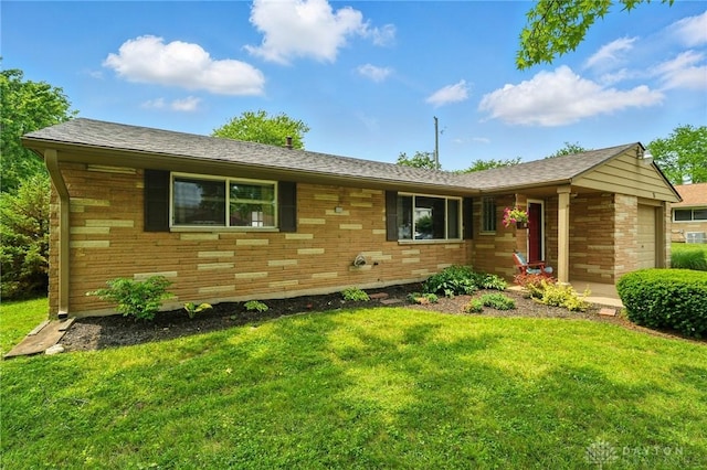 75 Royal Dr, Springboro, OH 45066 - view of front facade with a front lawn, brick siding, and an attached garage
