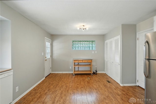 75 Royal Dr, Springboro, OH 45066 - unfurnished dining area featuring light wood-type flooring and healthy amount of natural light
