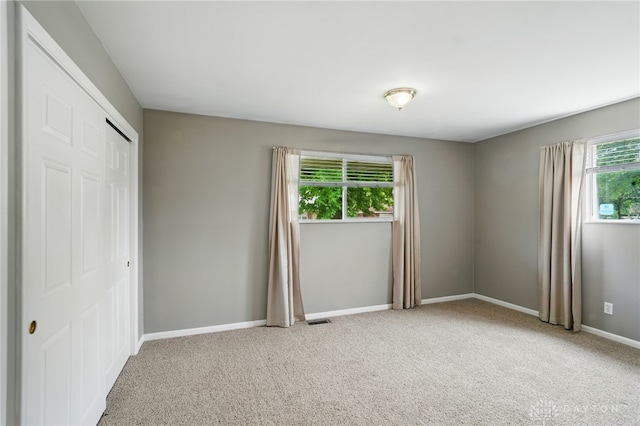 75 Royal Dr, Springboro, OH 45066 - unfurnished bedroom featuring carpet flooring and a closet