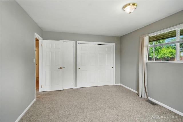 75 Royal Dr, Springboro, OH 45066 - unfurnished bedroom featuring carpet and a closet