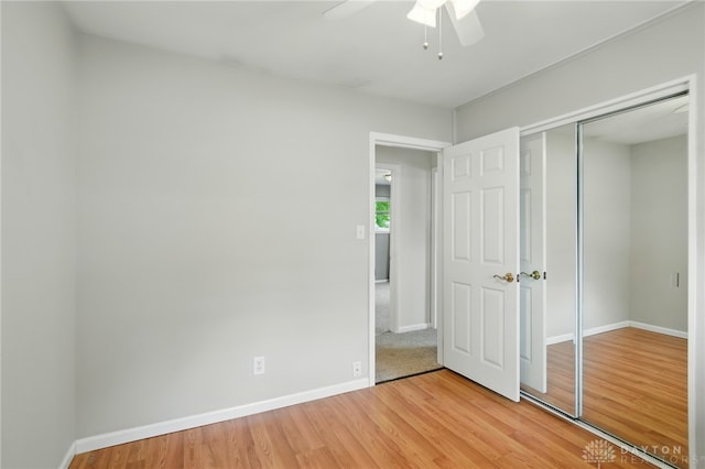 75 Royal Dr, Springboro, OH 45066 - unfurnished bedroom featuring light wood-style flooring, a closet, and a ceiling fan