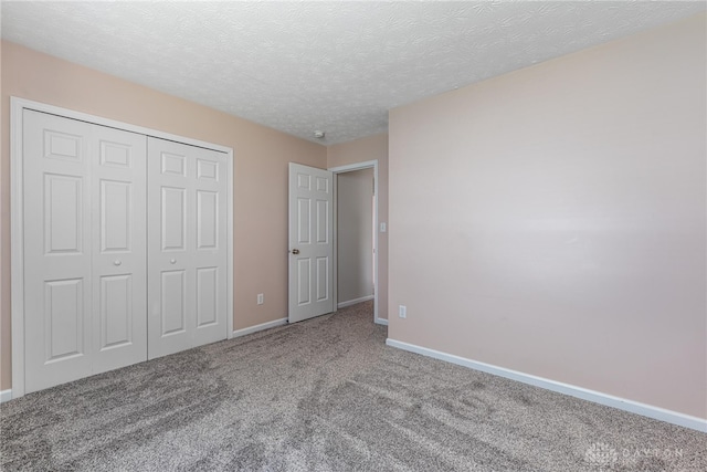 1928 Spring Ridge Dr, Xenia, OH 45385 - unfurnished bedroom with carpet, a closet, and a textured ceiling