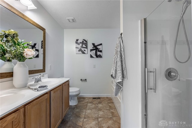 1928 Spring Ridge Dr, Xenia, OH 45385 - full bathroom featuring a shower with door, double vanity, stone finish flooring, and a textured ceiling