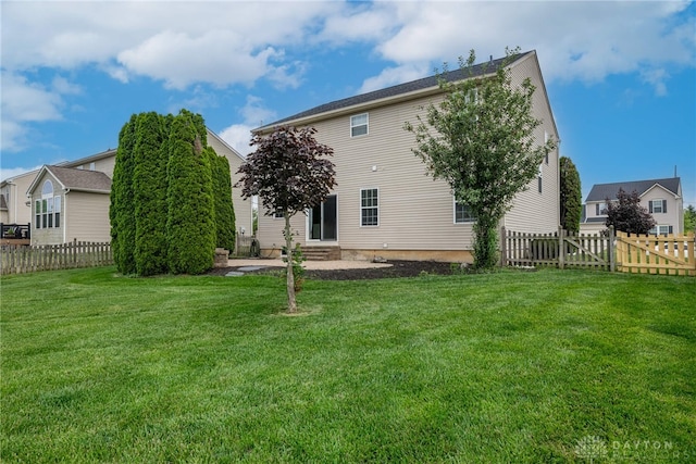 1928 Spring Ridge Dr, Xenia, OH 45385 - rear view of house with entry steps and a fenced backyard