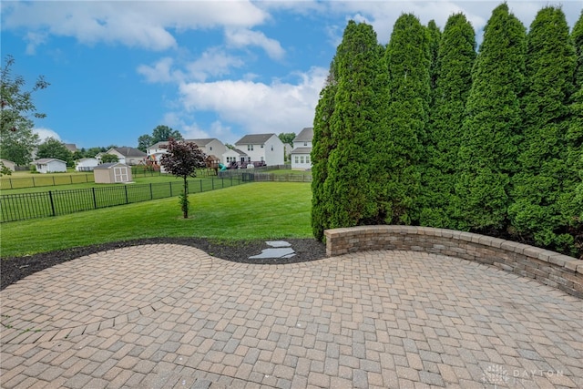 1928 Spring Ridge Dr, Xenia, OH 45385 - fenced backyard with a patio, a residential view, and a storage shed