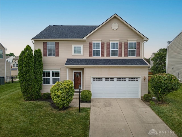1928 Spring Ridge Dr, Xenia, OH 45385 - traditional home featuring an attached garage, concrete driveway, and a shingled roof