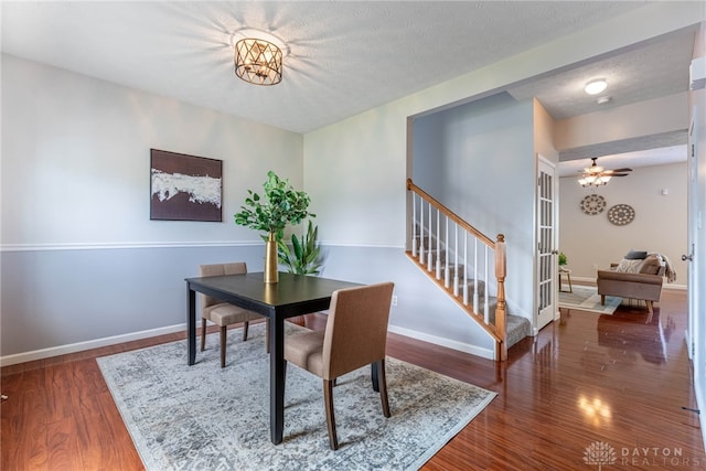 1928 Spring Ridge Dr, Xenia, OH 45385 - dining room with wood finished floors, stairs, ceiling fan, and a textured ceiling