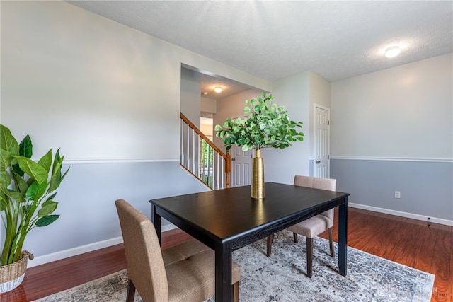 1928 Spring Ridge Dr, Xenia, OH 45385 - dining area with wood finished floors, stairway, and a textured ceiling