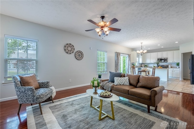 1928 Spring Ridge Dr, Xenia, OH 45385 - living area with a chandelier, light wood-style flooring, ceiling fan, a textured ceiling, and recessed lighting