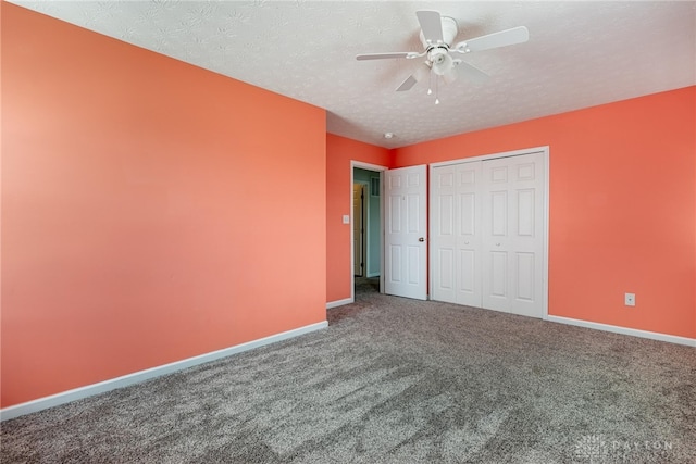 1928 Spring Ridge Dr, Xenia, OH 45385 - unfurnished bedroom with carpet floors, a closet, a textured ceiling, and ceiling fan