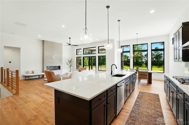 8559 Wandering Brook Way, Waynesville, OH 45068 - kitchen featuring appliances with stainless steel finishes, light wood-style flooring, ceiling fan, recessed lighting, and healthy amount of natural light