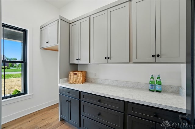 8559 Wandering Brook Way, Waynesville, OH 45068 - kitchen with light wood-style flooring and gray cabinetry