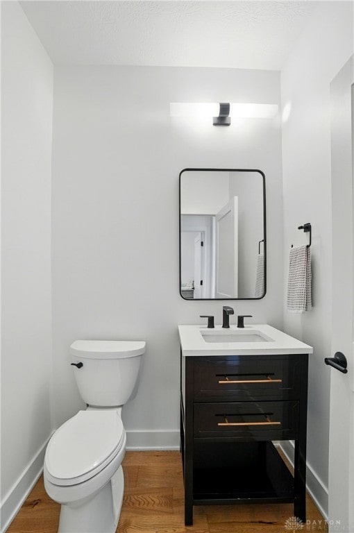 8559 Wandering Brook Way, Waynesville, OH 45068 - half bathroom featuring vanity and wood finished floors
