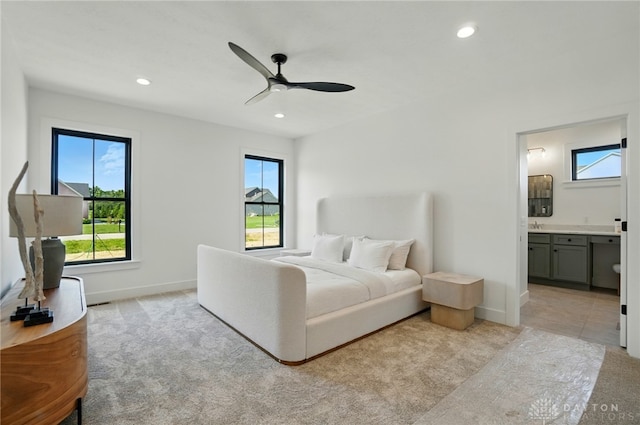 8559 Wandering Brook Way, Waynesville, OH 45068 - bedroom with light colored carpet, recessed lighting, ensuite bathroom, and ceiling fan