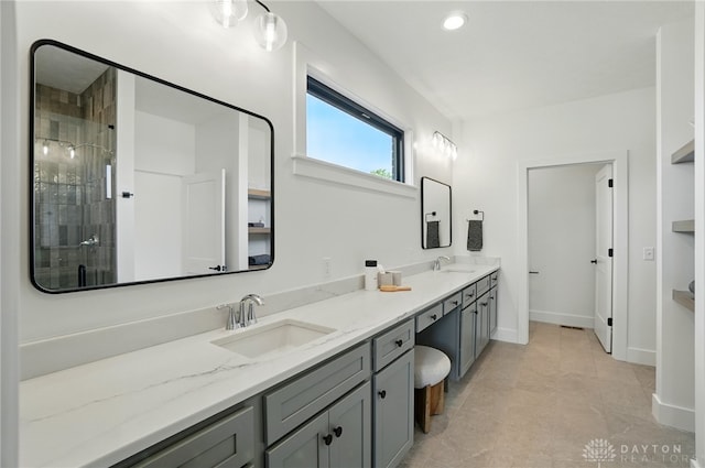 8559 Wandering Brook Way, Waynesville, OH 45068 - bathroom with double vanity, a tile shower, recessed lighting, and tile patterned flooring