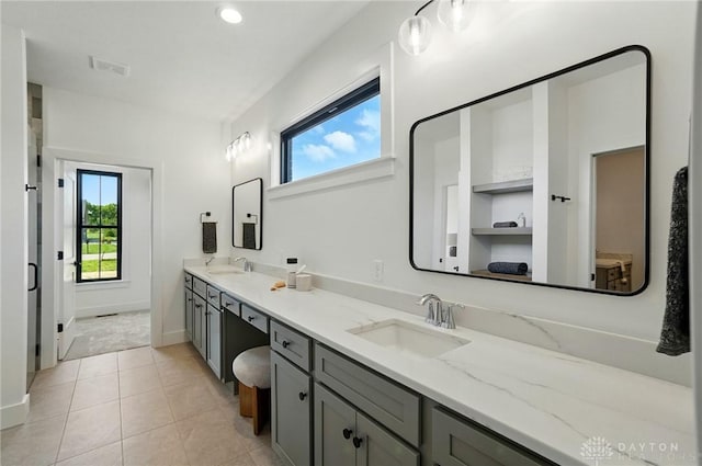 8559 Wandering Brook Way, Waynesville, OH 45068 - full bathroom featuring double vanity, tile patterned floors, and recessed lighting