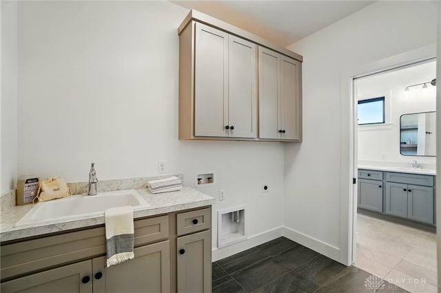8559 Wandering Brook Way, Waynesville, OH 45068 - laundry room featuring cabinet space, hookup for an electric dryer, washer hookup, and dark tile patterned flooring