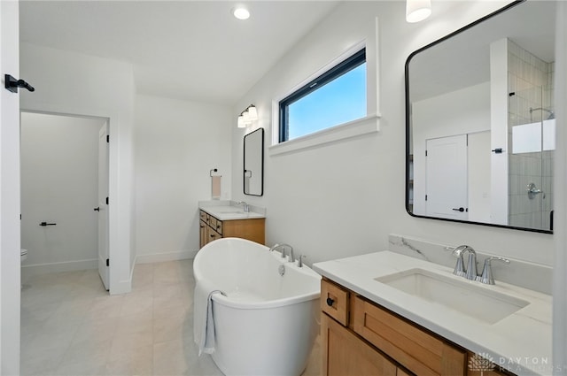 8559 Wandering Brook Way, Waynesville, OH 45068 - bathroom with a freestanding bath, two vanities, and tiled shower