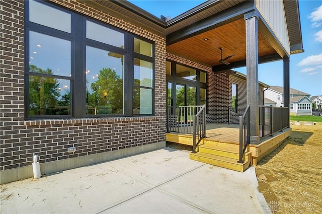 8559 Wandering Brook Way, Waynesville, OH 45068 - entrance to property with brick siding, a patio area, and a deck
