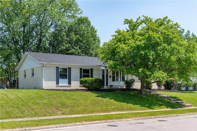 390 Washington Ave, Wilmington, OH 45177 - view of front facade with brick siding and a front yard