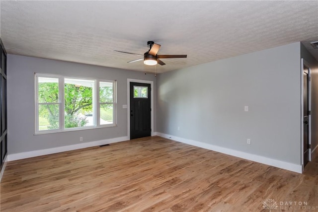 390 Washington Ave, Wilmington, OH 45177 - foyer entrance featuring light wood finished floors, a ceiling fan, and a textured ceiling