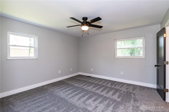 390 Washington Ave, Wilmington, OH 45177 - unfurnished room with dark carpet and ceiling fan