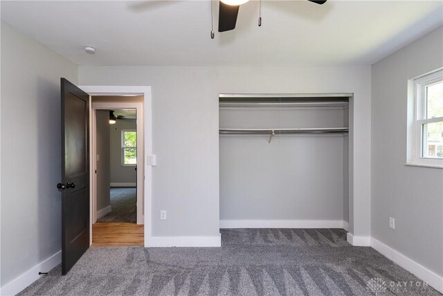 390 Washington Ave, Wilmington, OH 45177 - unfurnished bedroom with carpet flooring, a closet, and ceiling fan