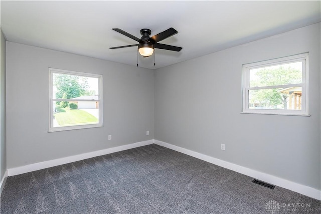 390 Washington Ave, Wilmington, OH 45177 - unfurnished room with dark colored carpet and a ceiling fan