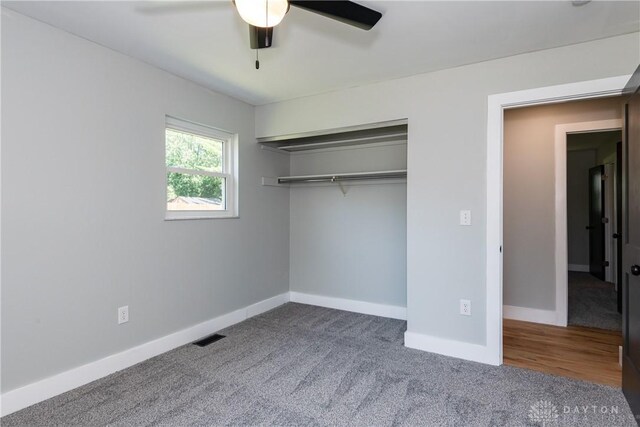 390 Washington Ave, Wilmington, OH 45177 - unfurnished bedroom with carpet flooring, a closet, and ceiling fan