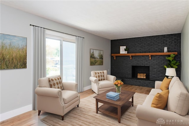 390 Washington Ave, Wilmington, OH 45177 - living room with light wood-type flooring and a brick fireplace