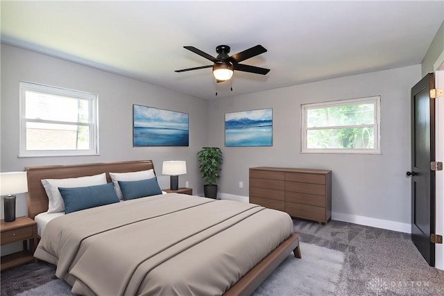 390 Washington Ave, Wilmington, OH 45177 - carpeted bedroom with multiple windows and ceiling fan