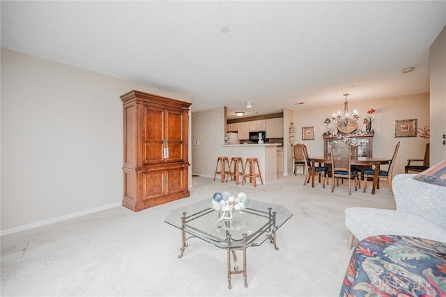 7636 Shawnee Ln Unit 206, West Chester, OH 45069 - living area featuring light colored carpet and a chandelier
