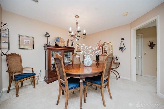 7636 Shawnee Ln Unit 206, West Chester, OH 45069 - dining area with a chandelier and light carpet