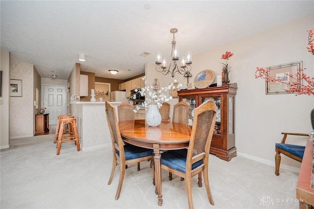 7636 Shawnee Ln Unit 206, West Chester, OH 45069 - dining space featuring a chandelier and light colored carpet