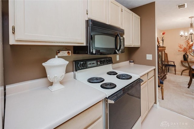 7636 Shawnee Ln Unit 206, West Chester, OH 45069 - kitchen with range with electric cooktop, black microwave, a chandelier, light countertops, and light carpet