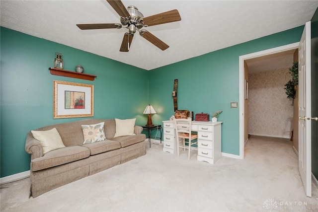7636 Shawnee Ln Unit 206, West Chester, OH 45069 - carpeted living room featuring baseboards and a ceiling fan