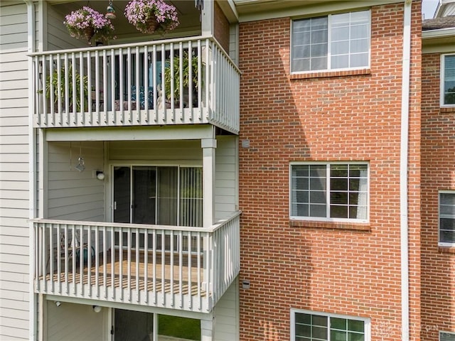7636 Shawnee Ln Unit 206, West Chester, OH 45069 - view of property exterior featuring a balcony and brick siding