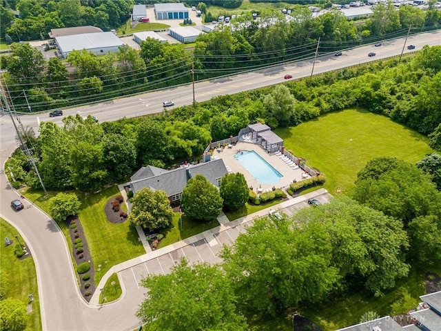 7636 Shawnee Ln Unit 206, West Chester, OH 45069 - drone / aerial view of a pool and a tree filled landscape