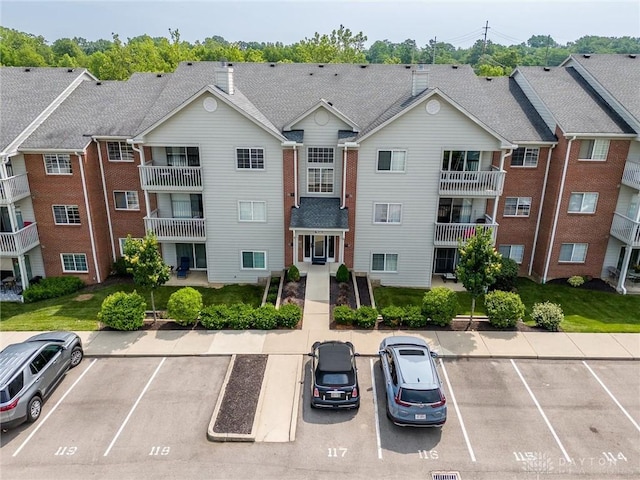 7636 Shawnee Ln Unit 206, West Chester, OH 45069 - view of property with uncovered parking