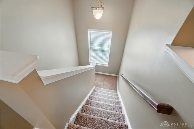 1956 Daffodil Dr, Xenia, OH 45385 - stairway featuring carpet and baseboards