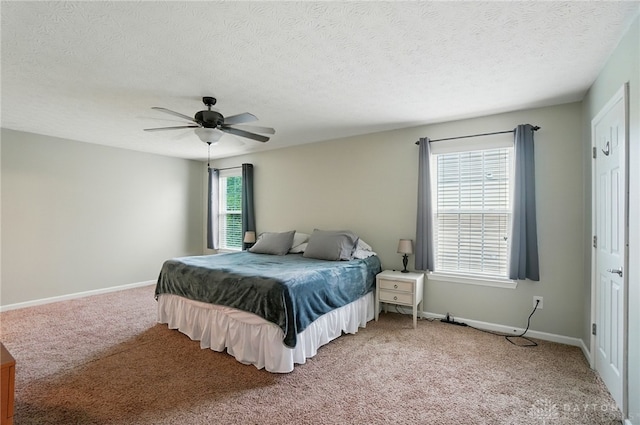 1956 Daffodil Dr, Xenia, OH 45385 - bedroom with light colored carpet, a ceiling fan, and a textured ceiling
