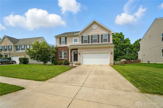 1956 Daffodil Dr, Xenia, OH 45385 - traditional-style home with an attached garage, driveway, and brick siding