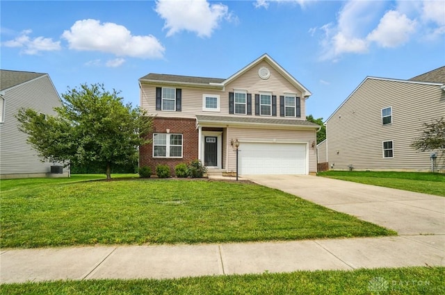 1956 Daffodil Dr, Xenia, OH 45385 - traditional home with driveway, an attached garage, a front yard, and brick siding