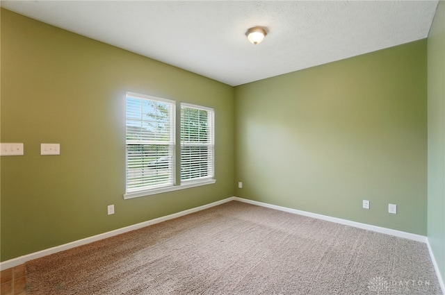 1956 Daffodil Dr, Xenia, OH 45385 - unfurnished room featuring baseboards and carpet floors