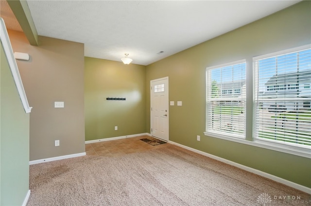 1956 Daffodil Dr, Xenia, OH 45385 - entrance foyer featuring carpet flooring and baseboards