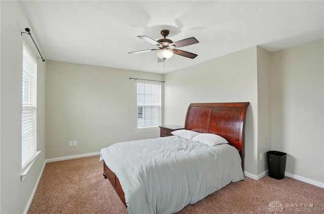 1956 Daffodil Dr, Xenia, OH 45385 - carpeted bedroom with multiple windows and ceiling fan