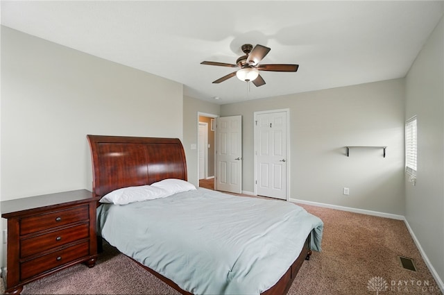 1956 Daffodil Dr, Xenia, OH 45385 - carpeted bedroom with baseboards and a ceiling fan