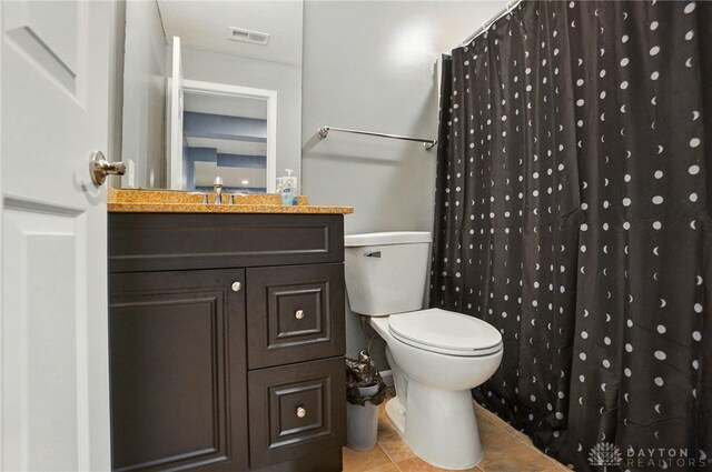 1956 Daffodil Dr, Xenia, OH 45385 - bathroom with vanity, tile patterned floors, and a shower with shower curtain