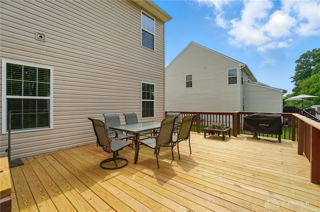 1956 Daffodil Dr, Xenia, OH 45385 - wooden terrace with outdoor dining space and a grill